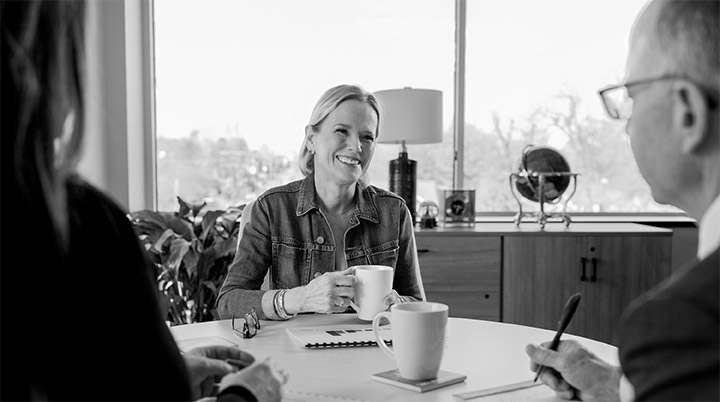 Woman meeting with financial advisors